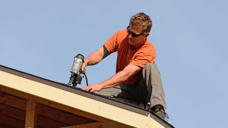 Worker fixing the roof